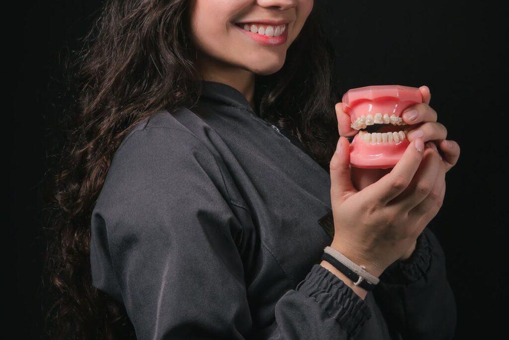 A Young Woman Presenting a Denture