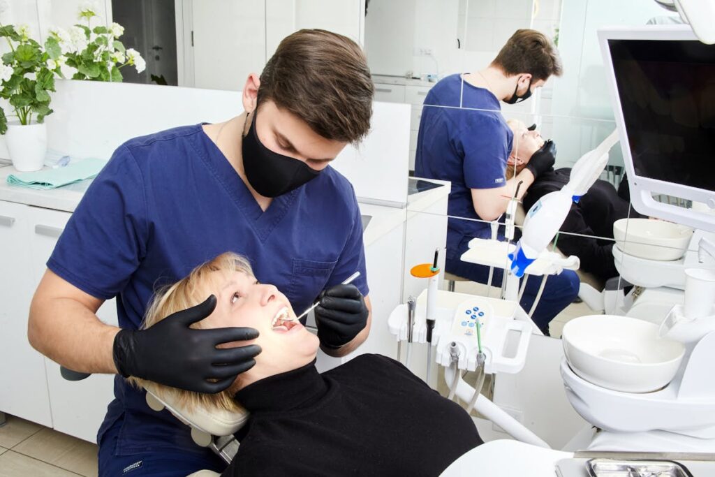 A Dentist Checking a Woman's Teeth