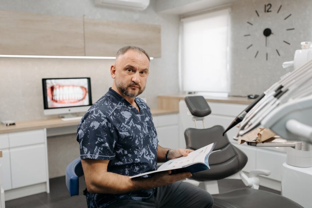 Man Sitting Beside the Dentist Chair