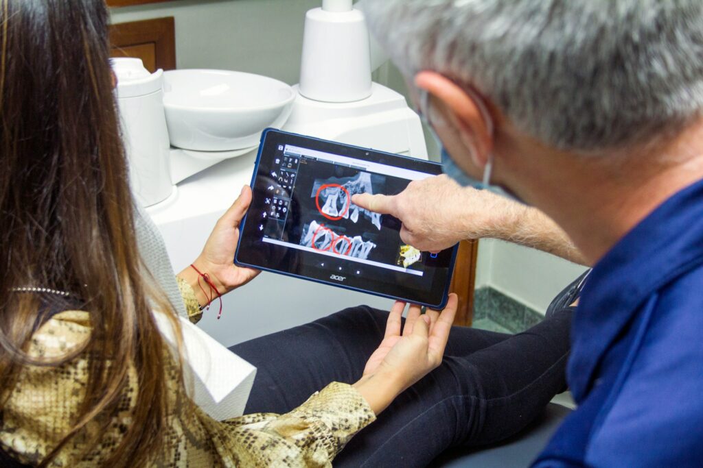 Woman in blue denim jeans holding black tablet computer photo