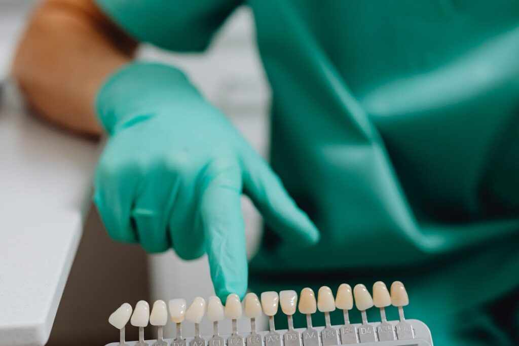 A Dentist Holding a Dental Shade Guide