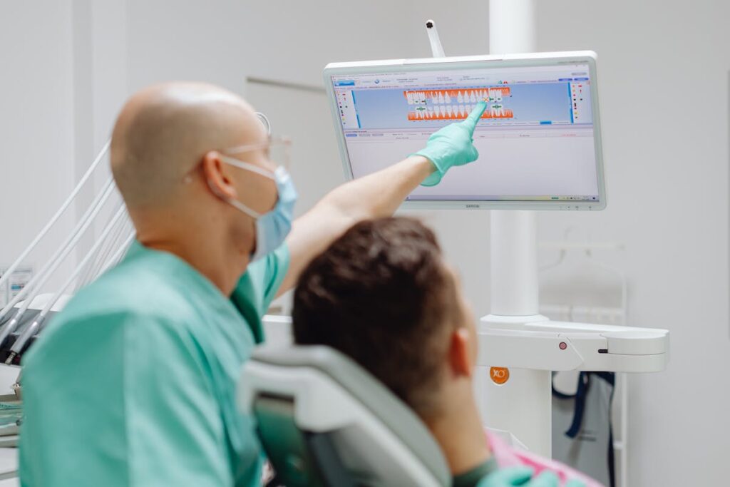 Dentist having a Discussion with a Patient