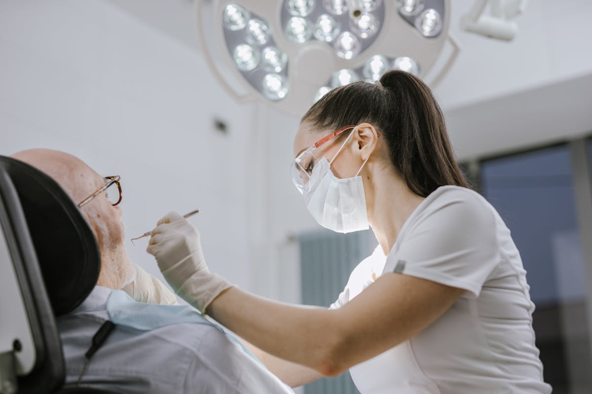 Female Dentist doing an Examination on her Elderly Patient