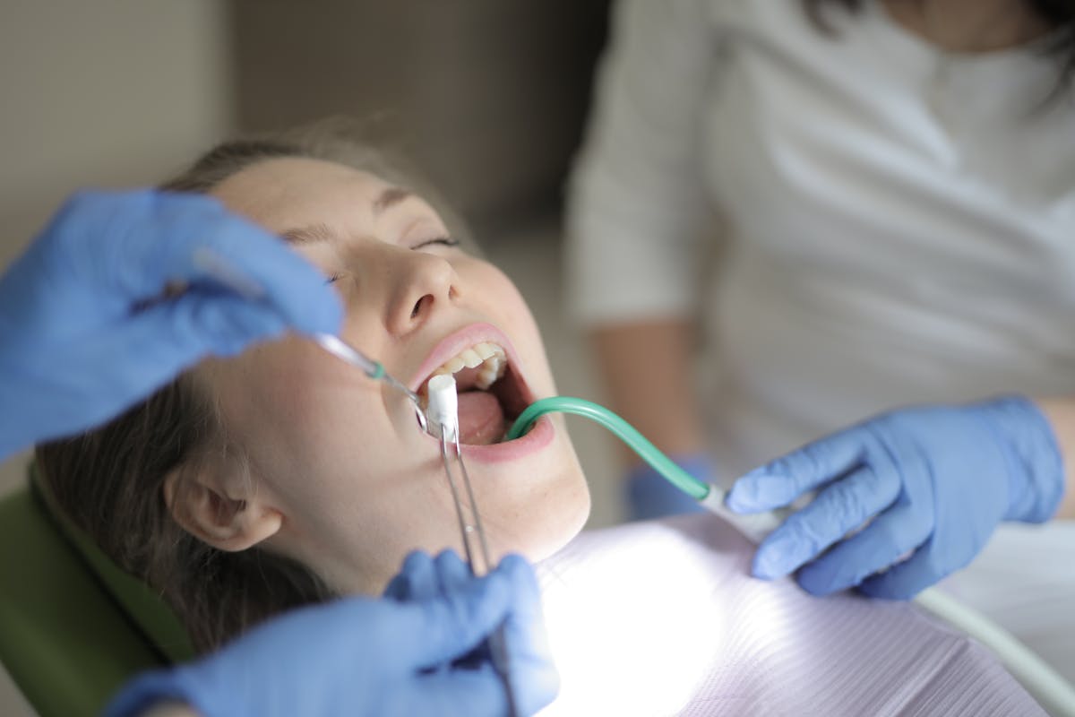 Unrecognizable dentists using medical equipment